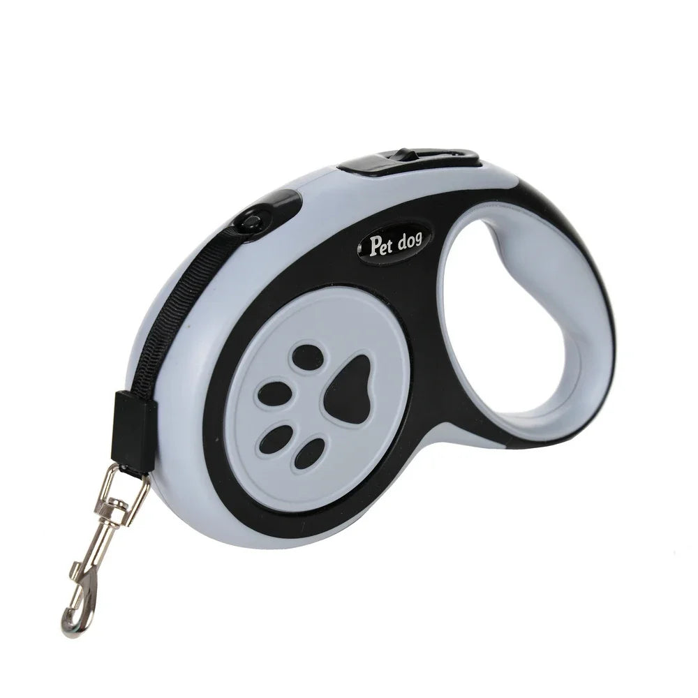 Correa retráctil de nylon blanca y negra para mascotas con asa y clip, sobre fondo blanco.