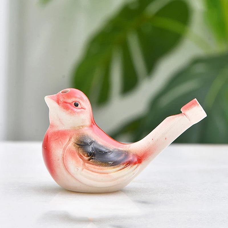 Keramische Pfeife in Form eines bunten Wasservogels mit rosa, weißer und schwarzer Markierung.