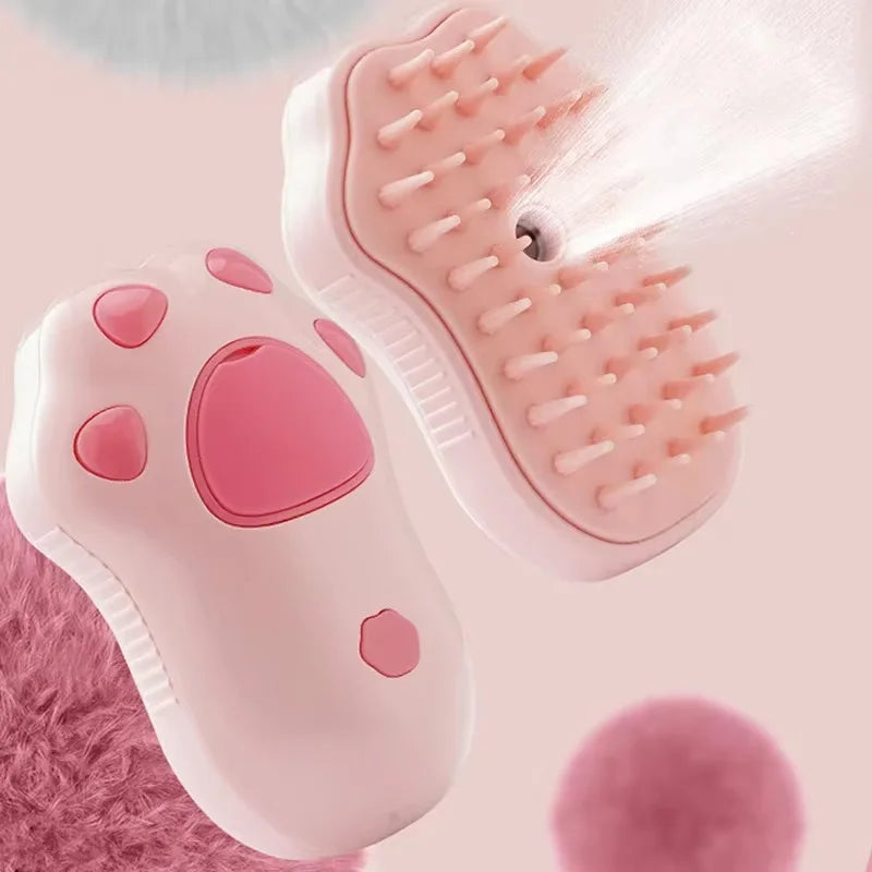 A pink electric pet grooming brush with a silicone comb is shown being used on a paw.