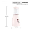 Bouteille d'eau rose à distributeur automatique pour animaux de compagnie.