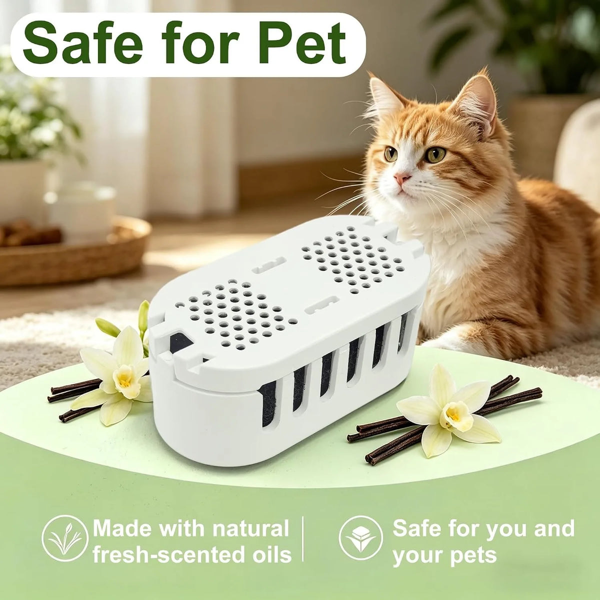 A white automatic cat litter box deodorizer is shown next to an orange tabby cat and some dried flowers.