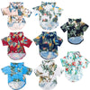 A collection of various Hawaiian leaf print dog shirts for summer in different colors and patterns.
