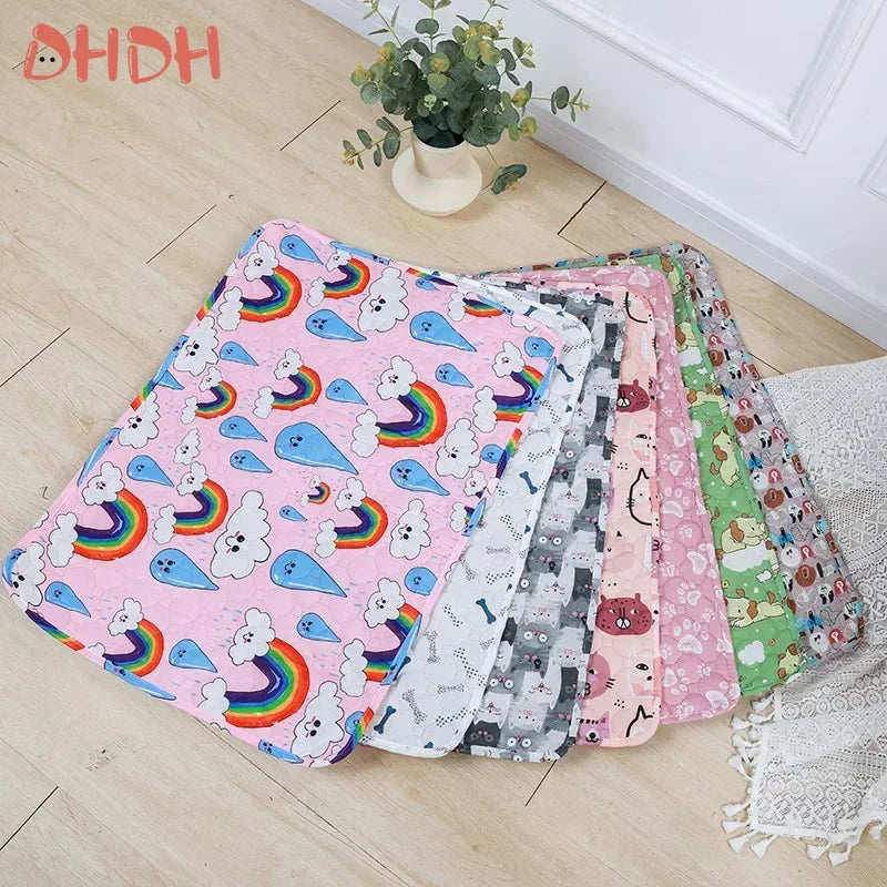 A collection of colorful washable pet training mats for dogs laid out on a light wooden floor.
