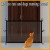 A heavy duty foldable pet gate and barrier fence with a mesh panel and an orange cat running in front of it.