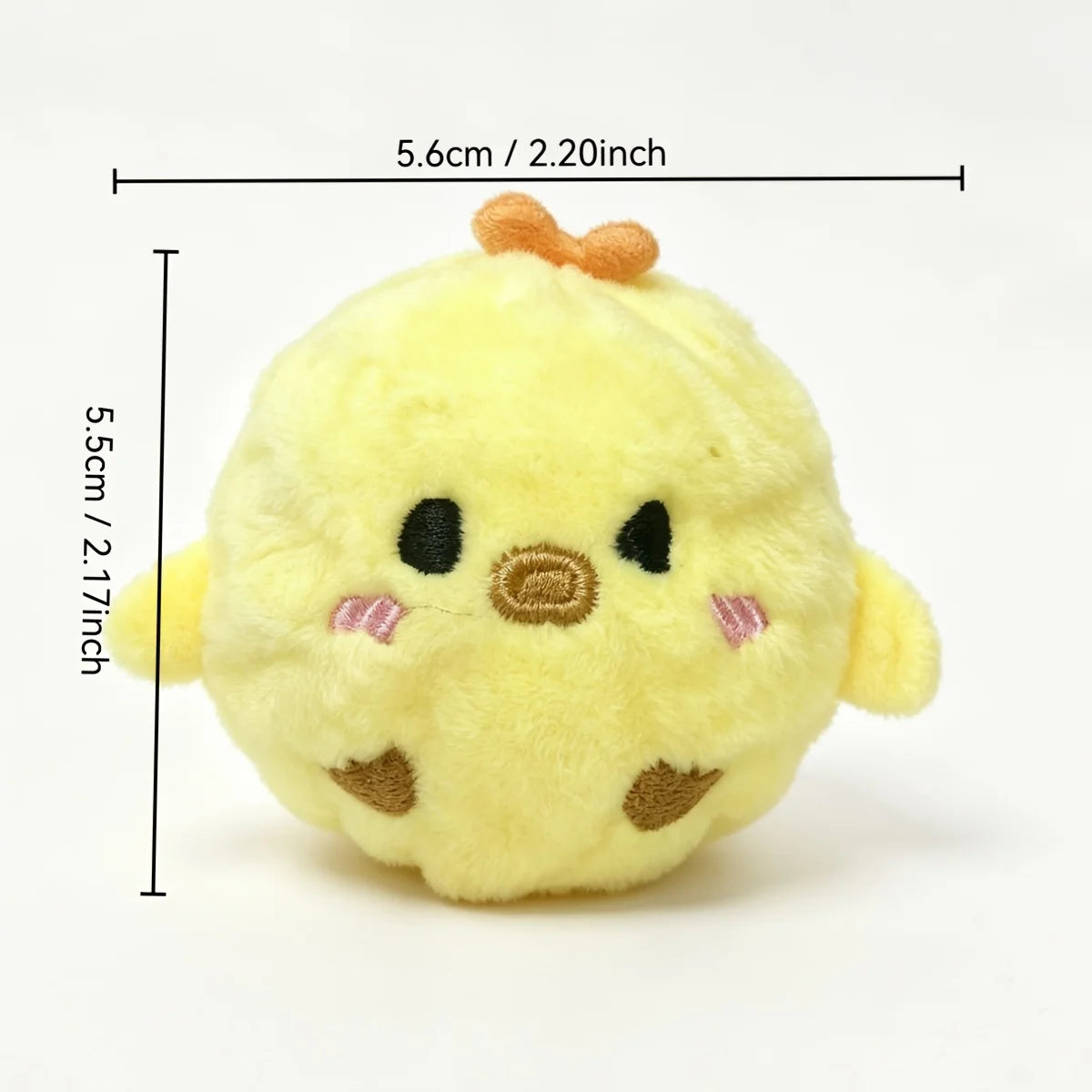 A small, yellow, plush squeaky bouncing chick ball for pets.