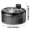 A black stainless steel pet water fountain with a visible water stream and sensor, shown from the top.
