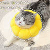 A gray cat is resting its head inside a yellow soft plush Elizabethan collar for pet wound care.