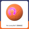 Oranger interaktiver Hund-Sprungball mit leuchtend violetter Schalter auf der Oberfläche
