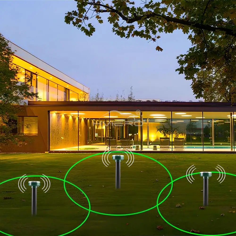 A solar powered ultrasonic pest repeller device is shown in a garden setting with green circles indicating its range.