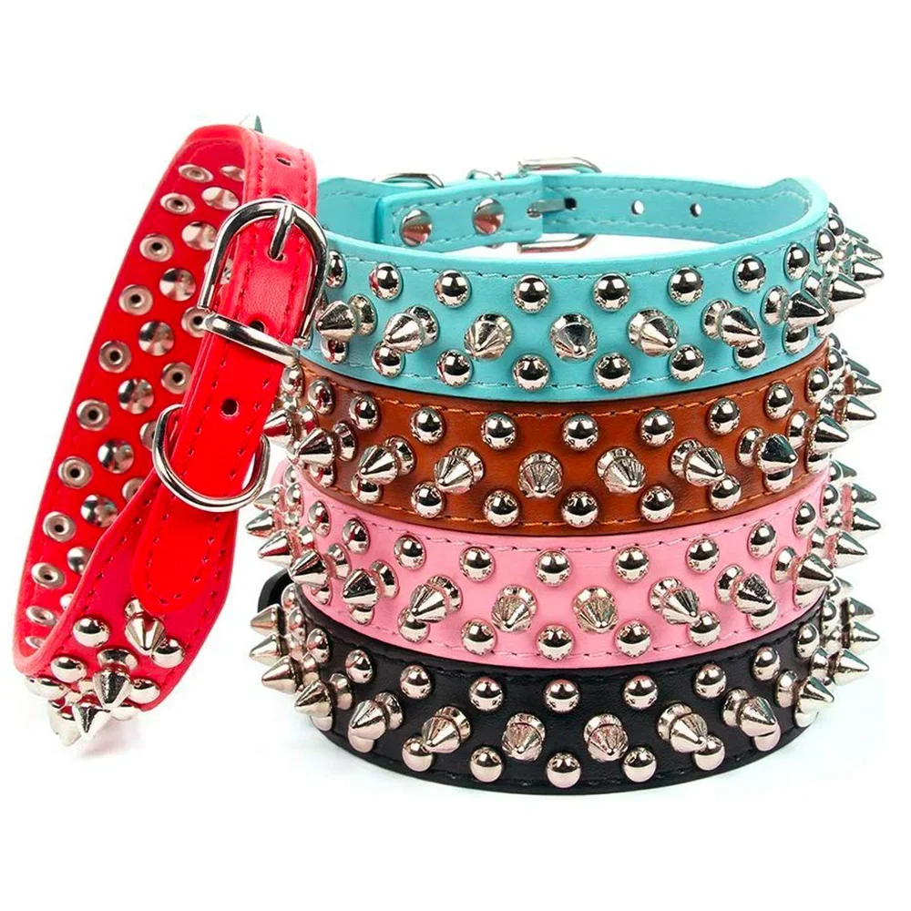 A stack of five adjustable leather spiked dog collars in various colors including red pink teal brown and black.