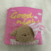 Pink snuffle book toy with a brown dog plush inside, designed for slow feeding and puzzle enrichment.