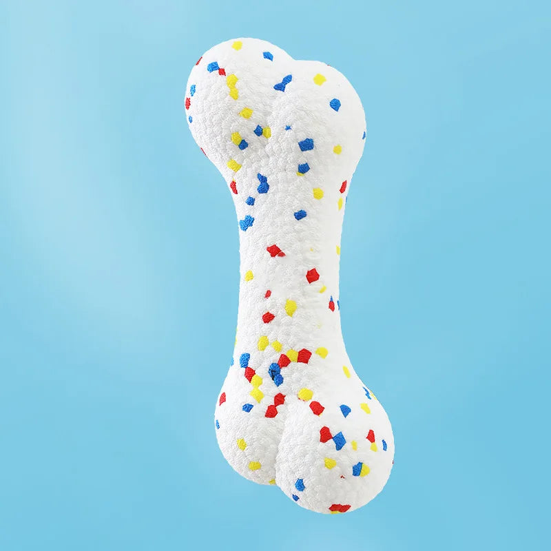 A white dog bone chew toy covered in colorful, bite-resistant balls for dogs.