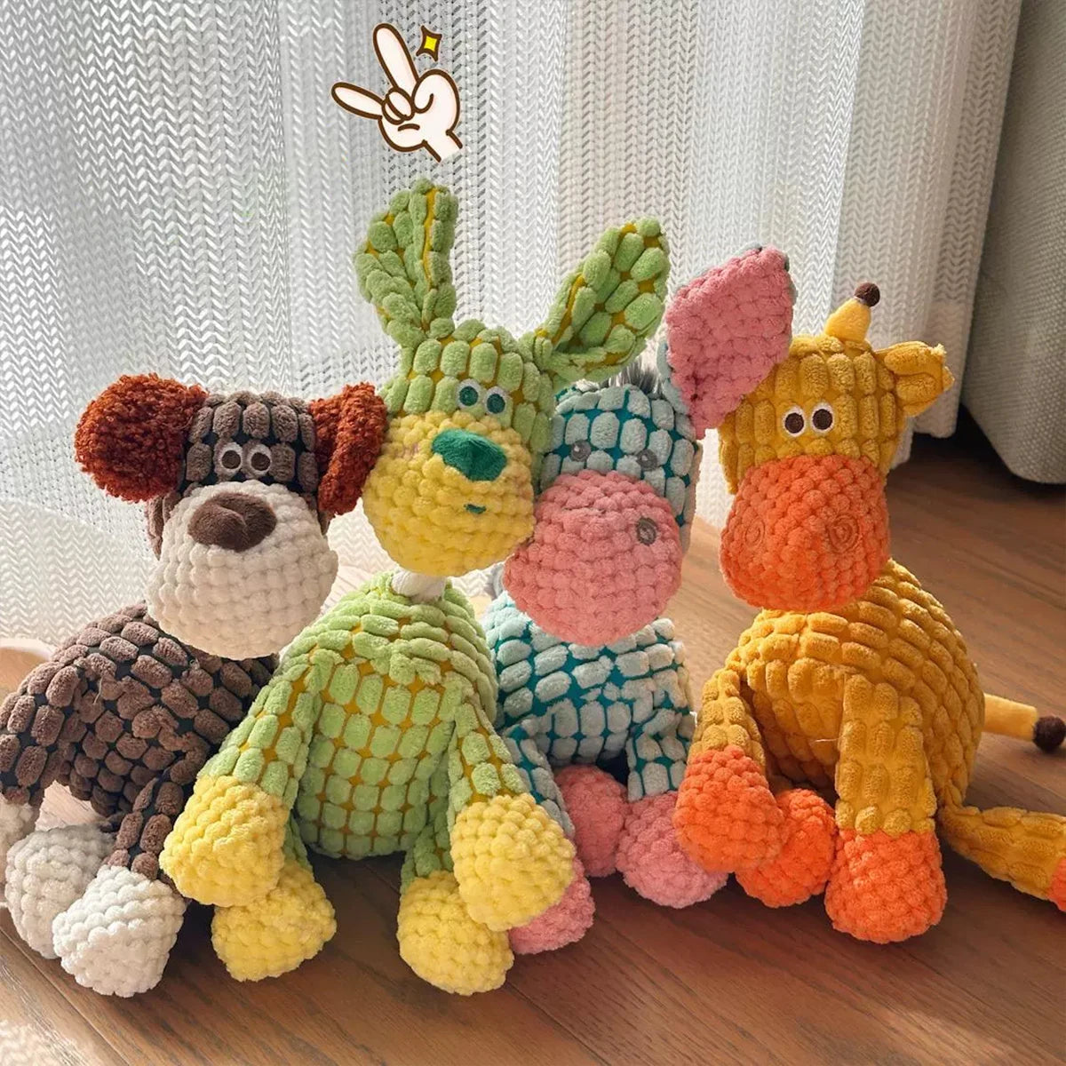 A collection of colorful squeaky donkey plush toys for dogs, featuring various textures and shades of green, yellow, pink, an