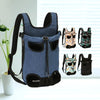 A dark blue adjustable backpack carrier for cats and dogs displayed next to several patterned carriers.