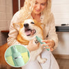 A woman is using a 4-in-1 rechargeable pet grooming kit with ceramic blades on a dog.