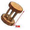 A natural wooden chew toy consisting of a round piece of wood and two wooden rods.