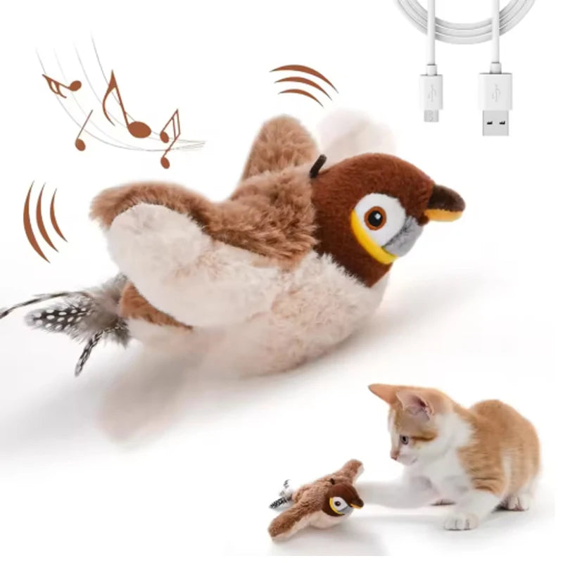 A fluffy brown and white bird toy is shown next to a small tabby kitten.