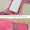 Detail display of a pink reusable dog diaper inner layer and an adjustable pink wrist strap.