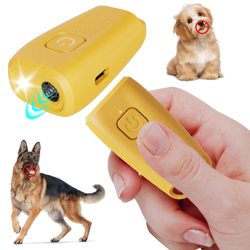 A yellow ultrasonic dog bark deterrent device is shown next to a small dog and being held by a hand.