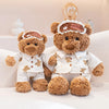 A fluffy teddy bear wearing pajamas with a good night headband and an eye mask.