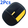 Two black reusable pet hair remover mitts with yellow accents shown from above.
