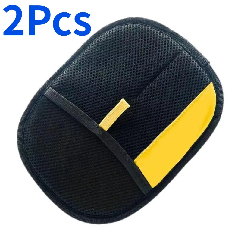 Two black reusable pet hair remover mitts with yellow accents shown from above.