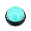 A round, teal-colored pet communication button with a black base.