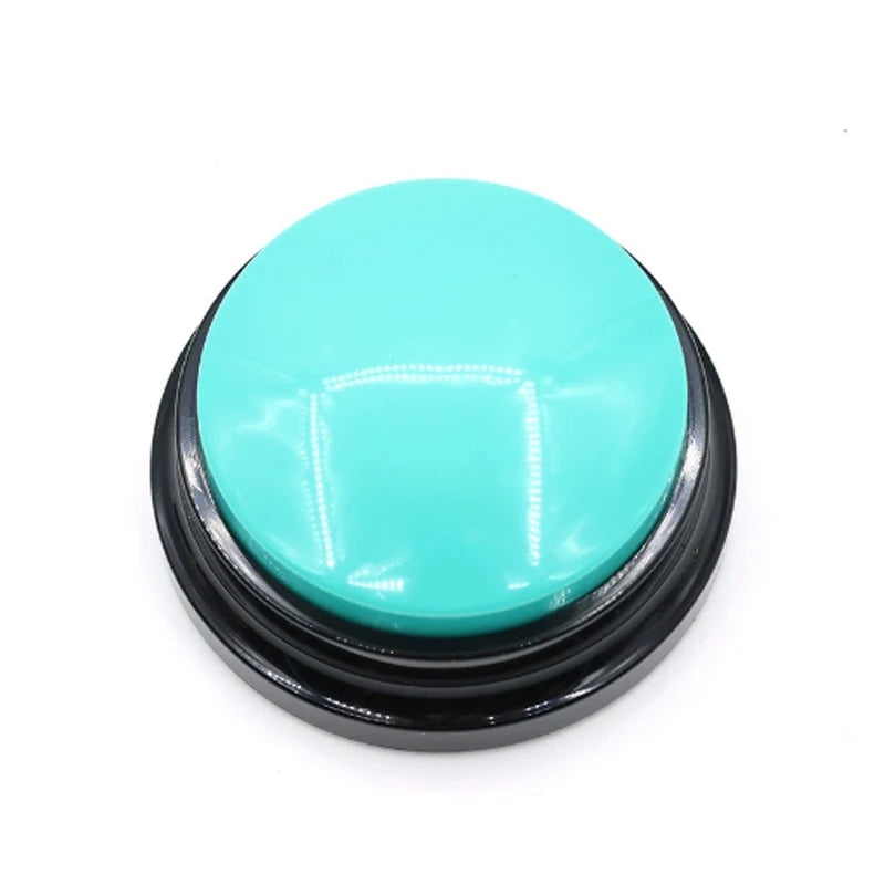 A round, teal-colored pet communication button with a black base.