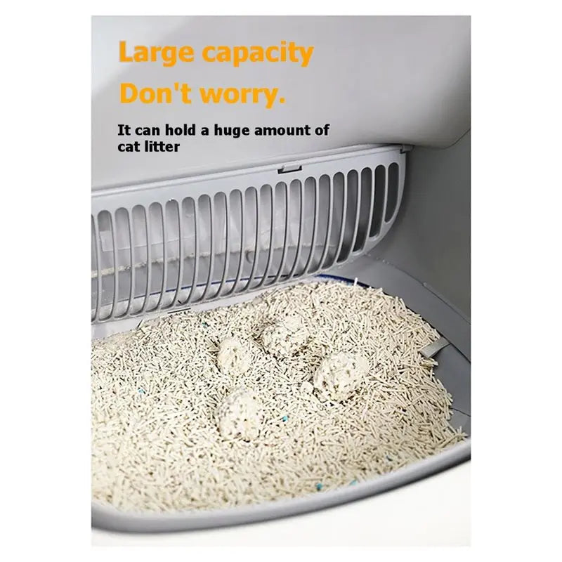 A white litter box with a large capacity replacement liner filled with light-colored cat litter.