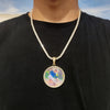 A custom photo pendant necklace with a gold finish is worn around the neck against a black shirt.