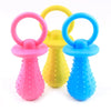 Three rubber chew toys in pink, yellow, and blue for small dogs