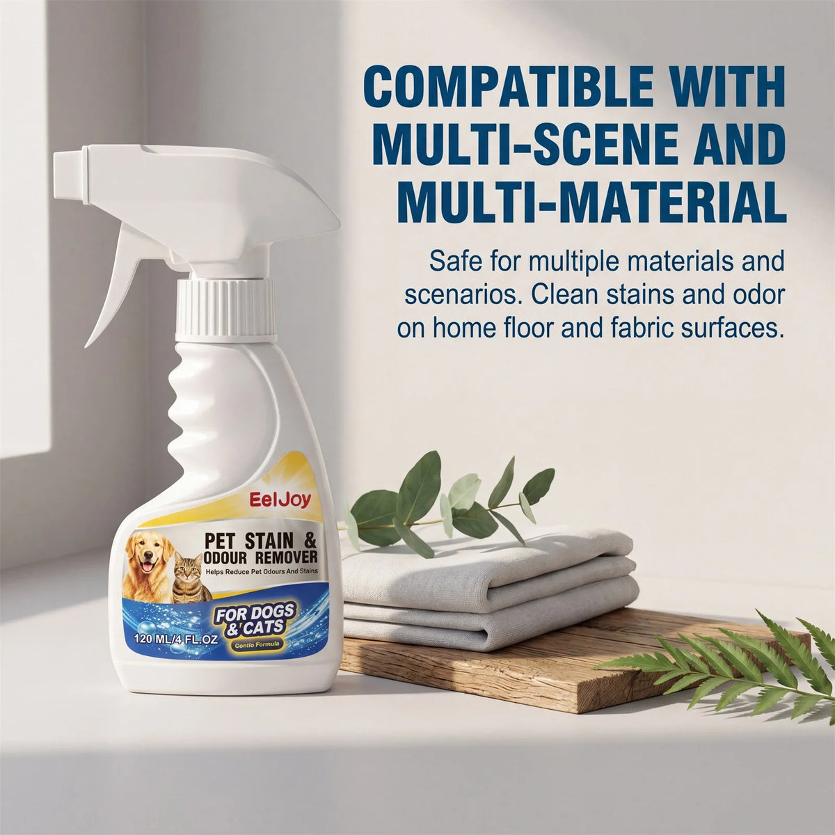 A white spray bottle of Pet Stain & Odor Remover is shown next to a stack of white towels on a wooden surface.