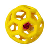 Yellow natural rubber interactive dog chew ball with a bell, featuring an octagonal honeycomb structure.