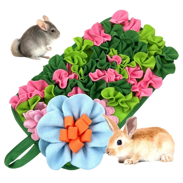 A mat featuring colorful fabric flowers and leaves designed for interactive pet foraging with small animals.