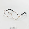 Vintage round gold-rimmed sunglasses with black arms