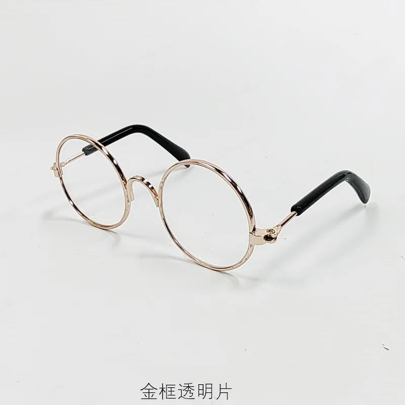 Vintage round gold-rimmed sunglasses with black arms
