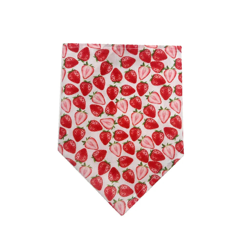 A red strawberry print bandana featuring strawberries on a white background.