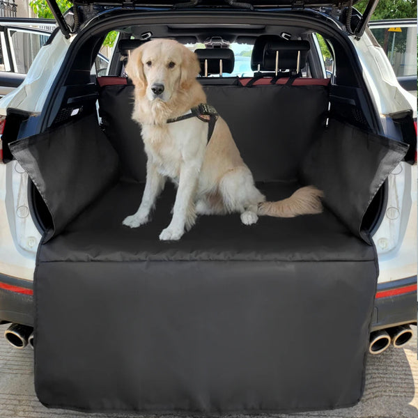A golden retriever sits on a black waterproof dog car seat cover inside a vehicle.