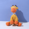 A yellow plush toy resembling a donkey or dog with an orange snout and textured fur.