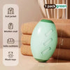 A light green reusable gel lint roller is shown next to stacked beige fabric and various clothing items.
