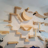 Wall mounted cat climbing shelf and bridge made of light wood planks