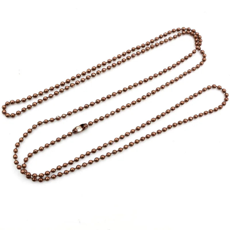 A set of brown plated ball bead necklaces laid out on a white background.