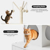 A large cat enclosure featuring dangling balls and a hidden litter box for a cat.
