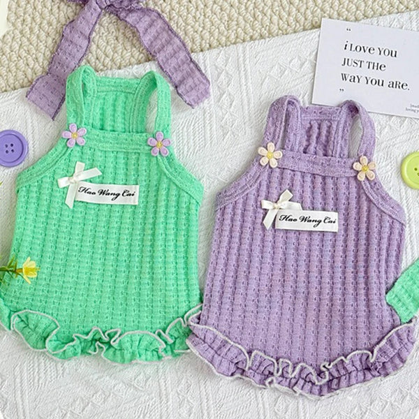 A pair of floral lace pet vests for dogs and cats in mint green and lavender colors.