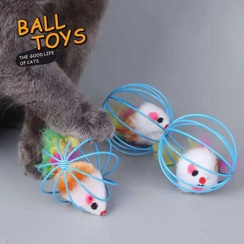 A close-up of an interactive cat toy featuring a rolling mouse and sand chamber, with a gray cat paw visible.