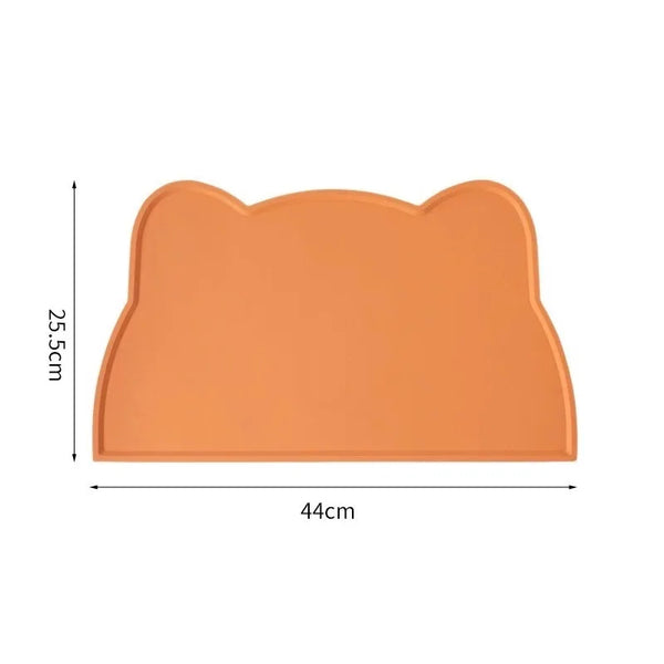 An orange cat head shaped silicone pet feeding mat with dimensions 44cm by 25.5cm.