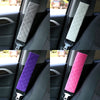 Close-up view of a plush car seat belt shoulder protector in various colors including gray, cream, purple, and pink.