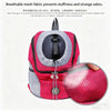 A pink and gray breathable mesh fabric pet carrier backpack with a black mesh ball visible.