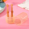 A silicone pet toothbrush set for cats and dogs with storage case, showing two orange toothbrushes inside a clear container.