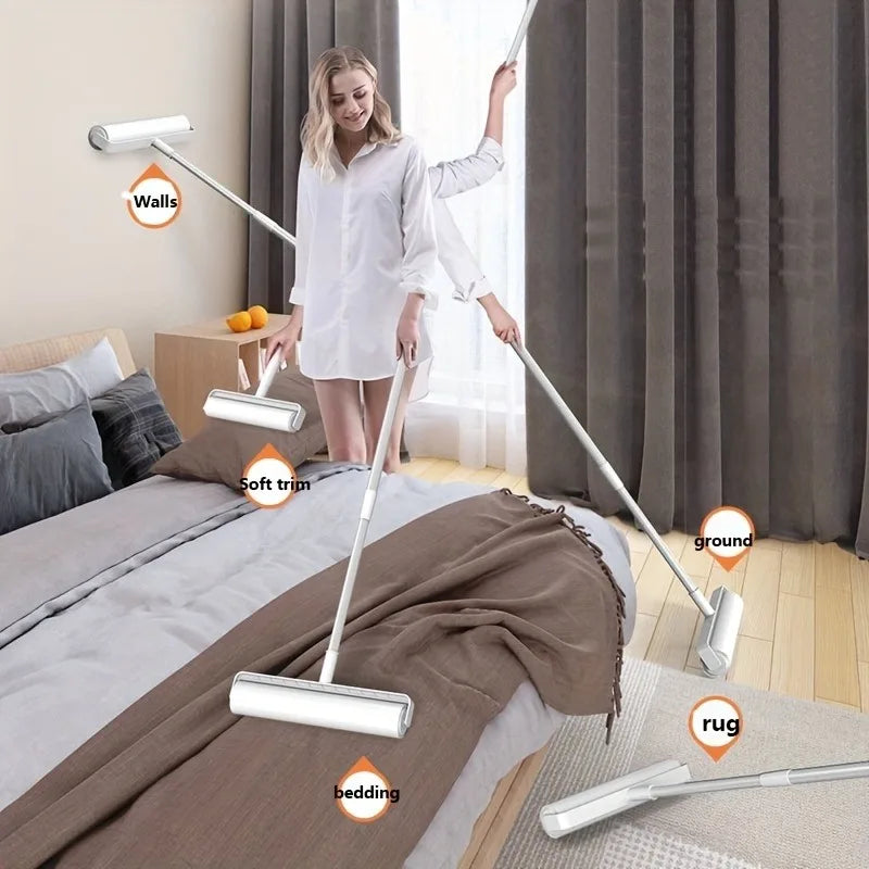 A woman is using a white retractable lint roller mop with soft trim and ground attachments on a wooden floor.